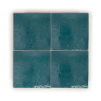 Blue Medina zellige tile 4x4 glossy, deep saturated blue handmade terracotta with natural glaze variation.