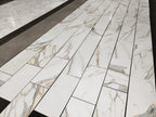Aria Calacatta Gold Marble-patterned tiles on a floor