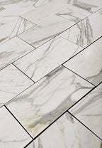Calacatta Gold Marble- 12X24 patterned tiles arranged in a grid