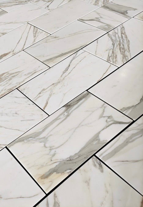 Calacatta Gold Marble- 12X24 patterned tiles arranged in a grid