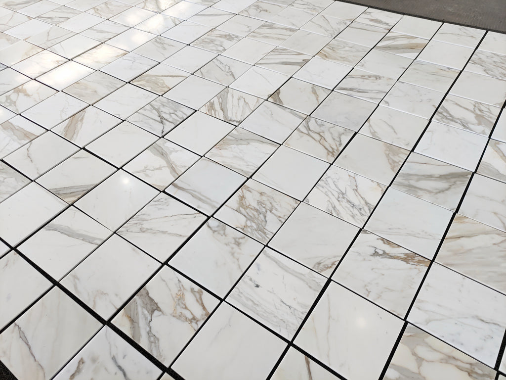 calacatta gold 12x12 marble tiles dry-lay for inspection and designer's final project approval 