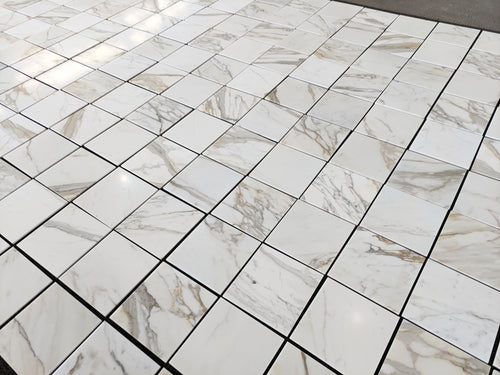 calacatta gold 12x12 marble tiles dry-lay for inspection and designer's final project approval 