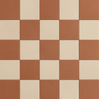Terracotta and sand checkerboard pattern in matte plaster-look porcelain tile.